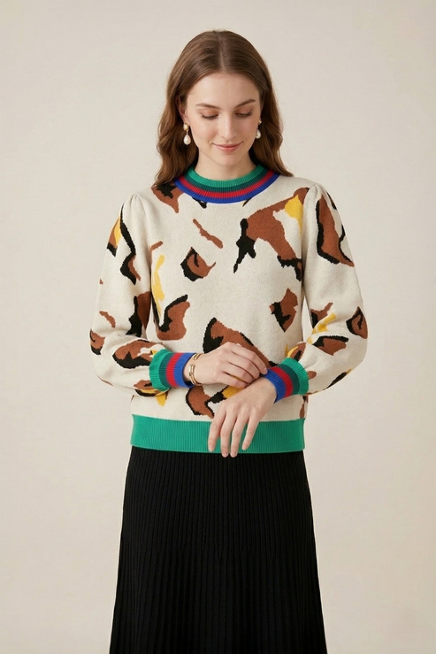 Abstract print stripe trim knit sweater front view showing puff sleeves and multicolour striped cuff detail