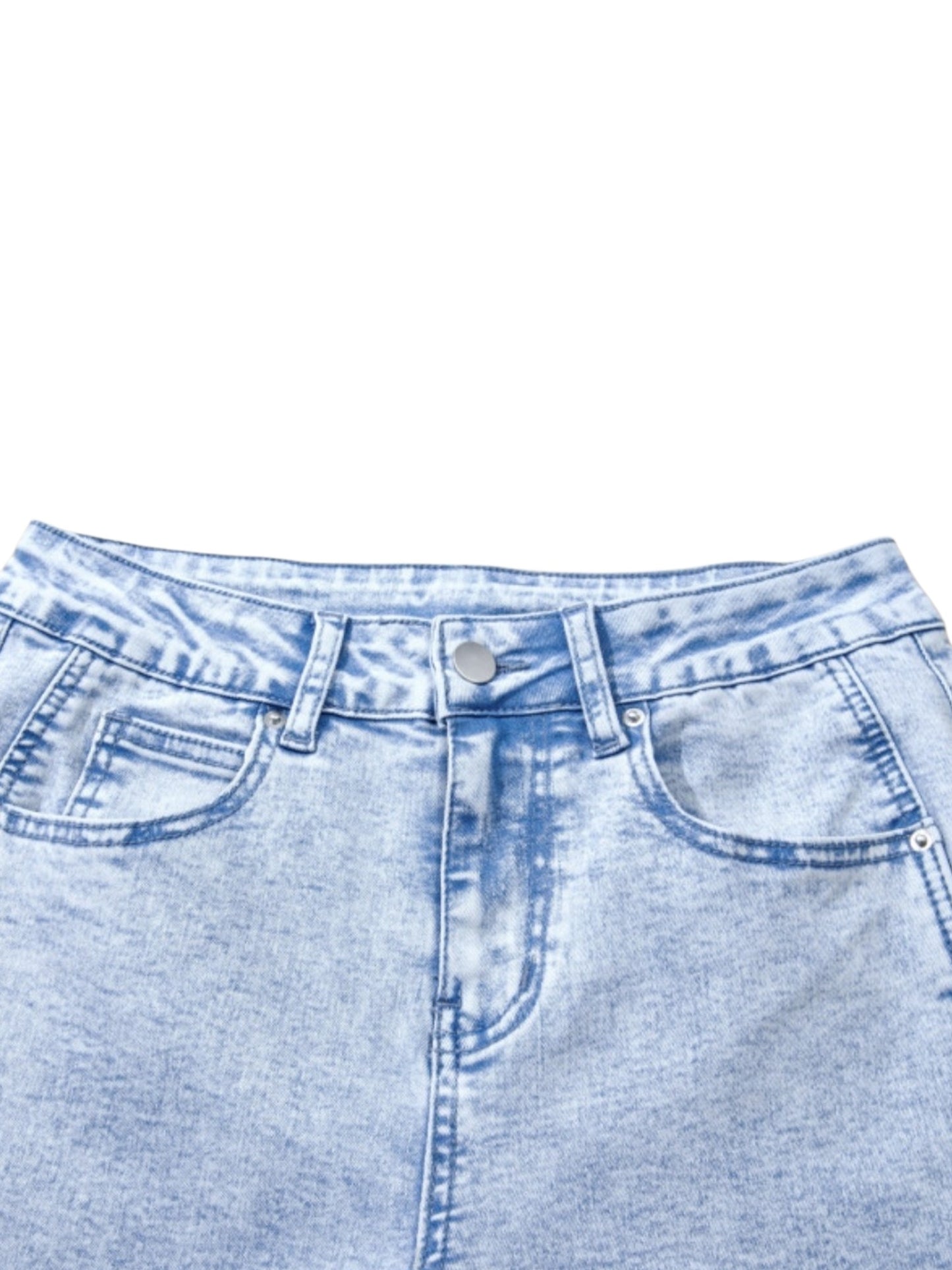 Close-up of the waistband and front pockets of light blue denim jeans on a white background.