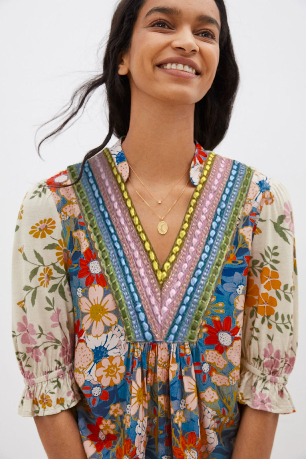 Front view of a multicolor boho blouse with a V-neck and half sleeves.