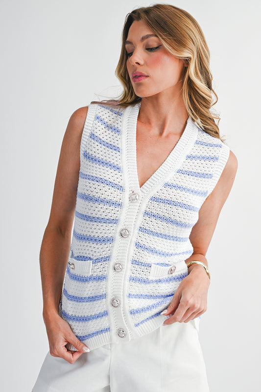 Woman wearing a sleeveless striped cardigan on a white background