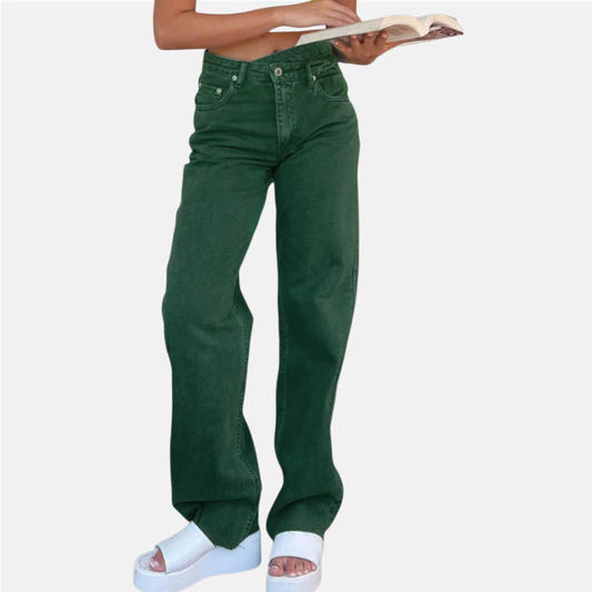 Green jeans worn by a person on a white background