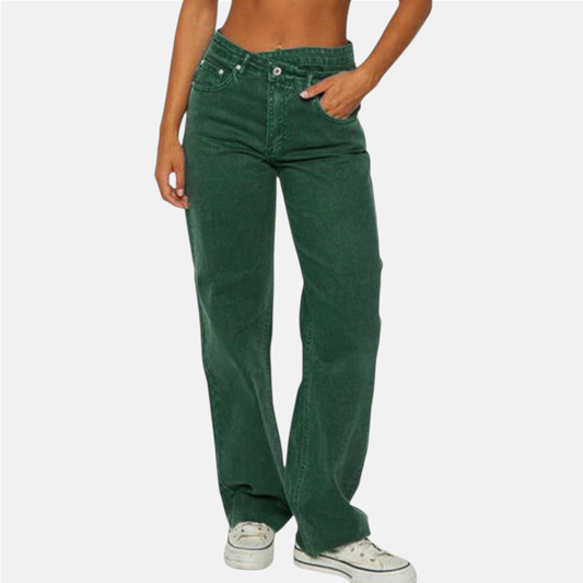 Green jeans worn by a person on a white background