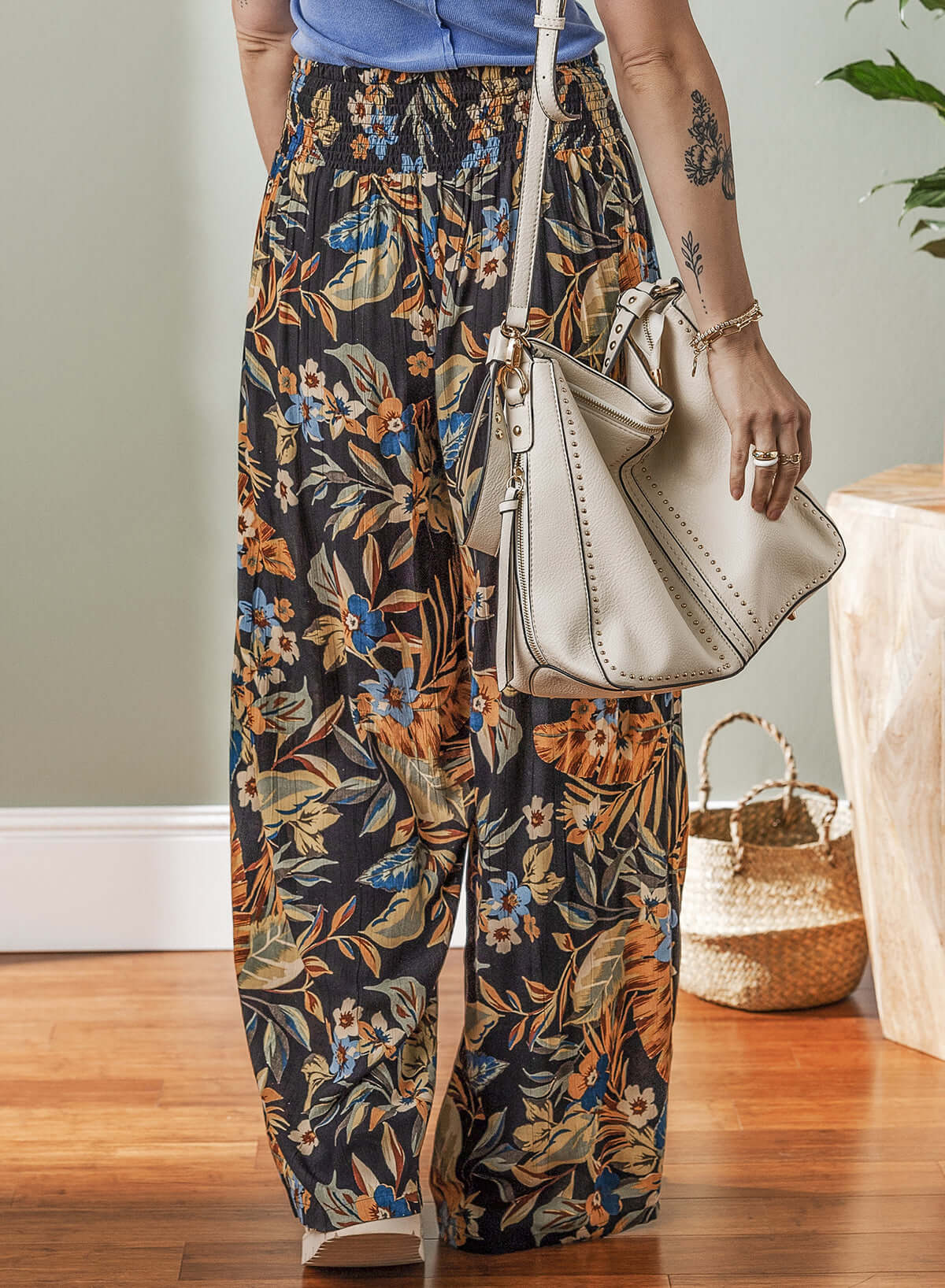 Women's floral wide-leg pants with a shirred tie waist, perfect for summer styling.