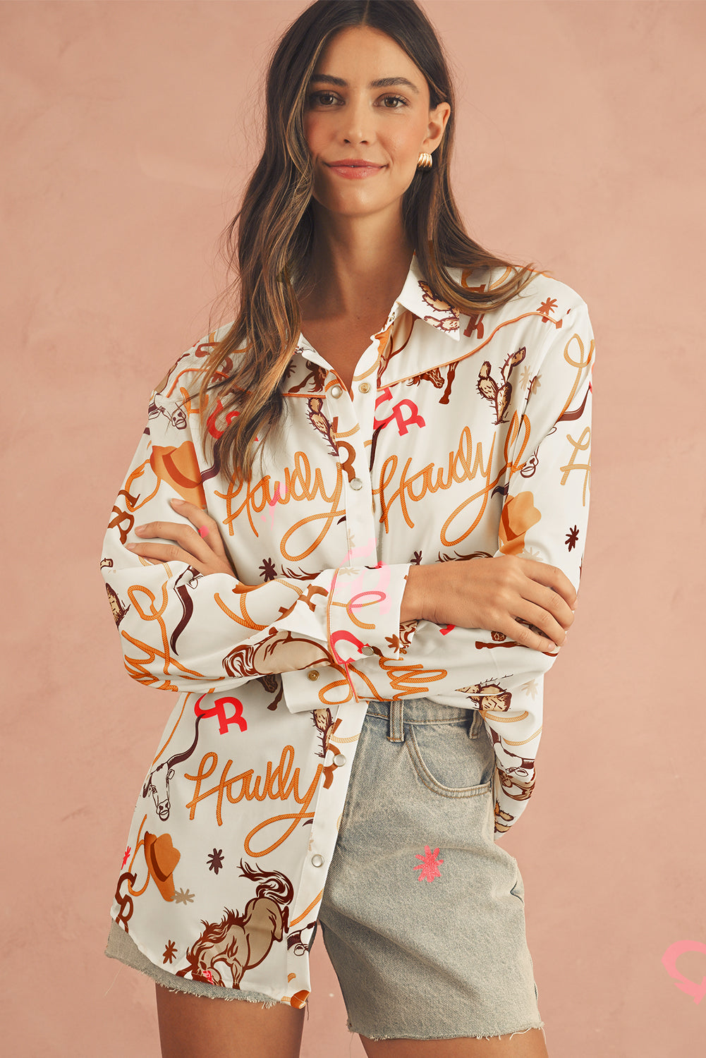 Front view of a beige Howdy abstract print shirt with long sleeves.