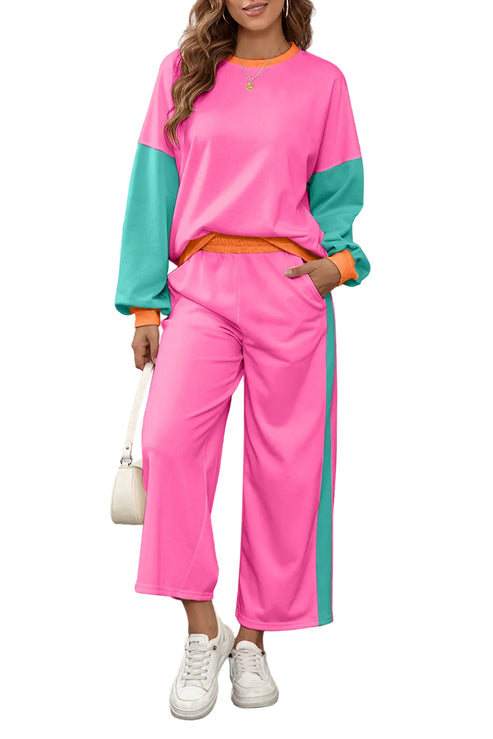 Woman wearing a pink and green color-blocked outfit against a white background.
