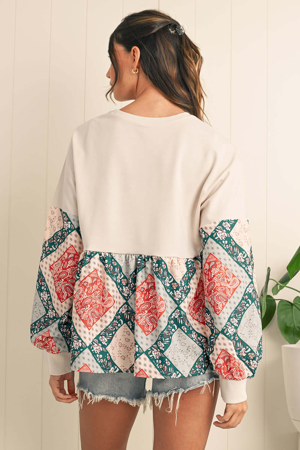Women's floral patchwork top with boho-style balloon sleeves, perfect for casual Aussie fashion.