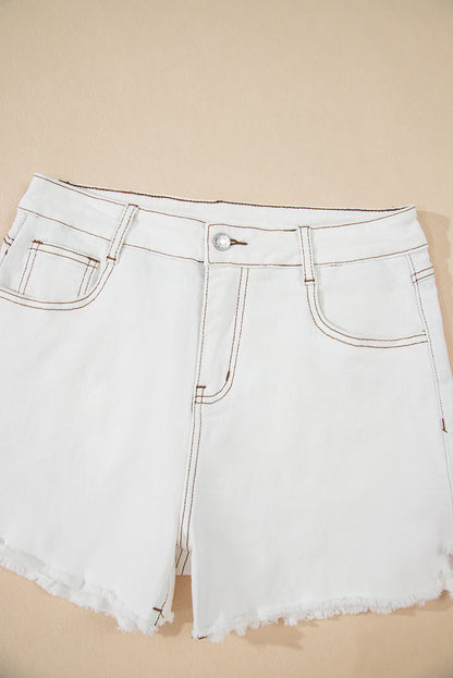 White denim shorts on a beige background