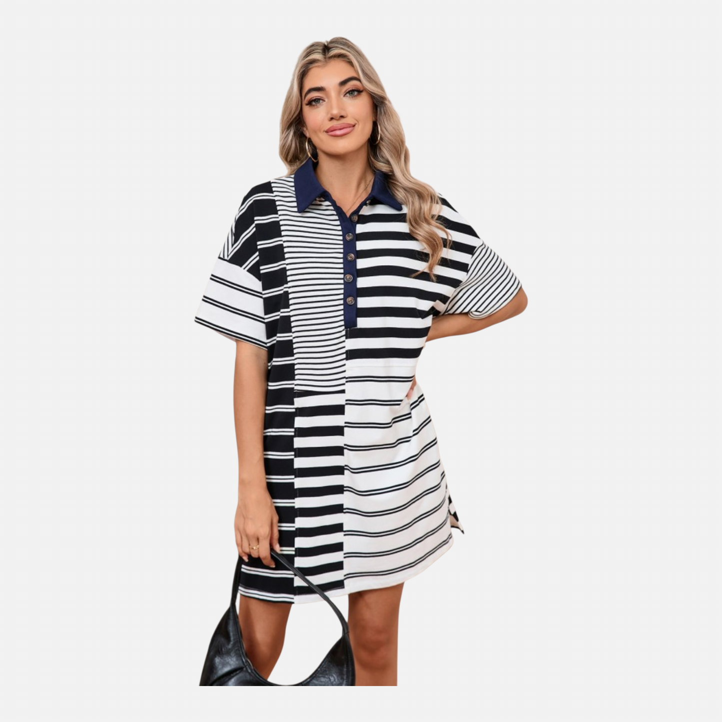Woman wearing a black and white striped dress on a white background
