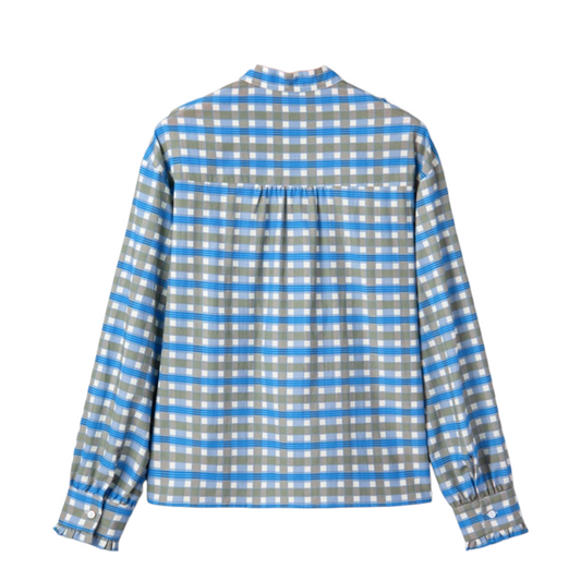 Back view of a blue checked cotton-blend shirt showing the pleated back yoke and ruffled sleeve cuffs.