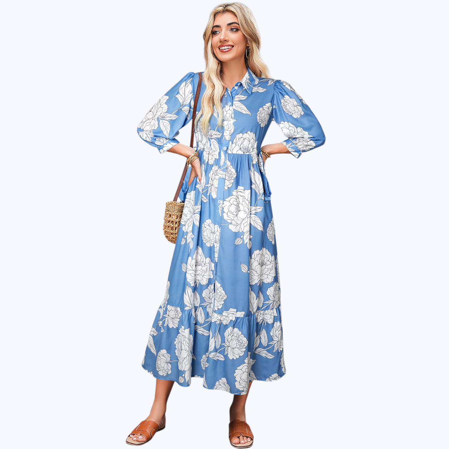 Woman wearing a blue floral dress on a white background