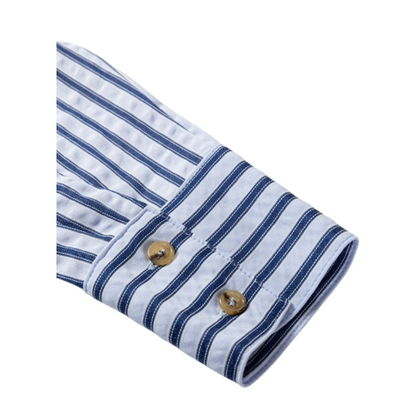 Folded blue and white striped shirt with wooden buttons on a white background