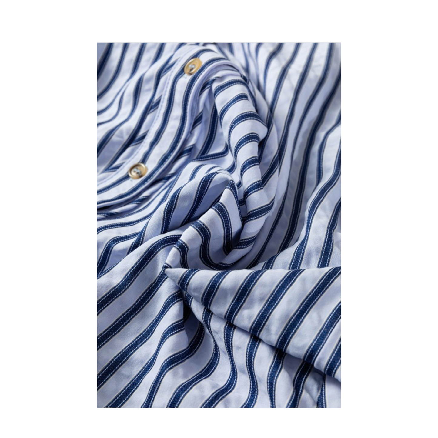 Close-up of a blue and white striped fabric with gold buttons.