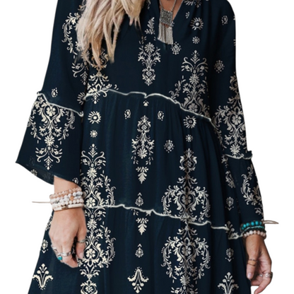Navy blue dress with white floral patterns worn by a person