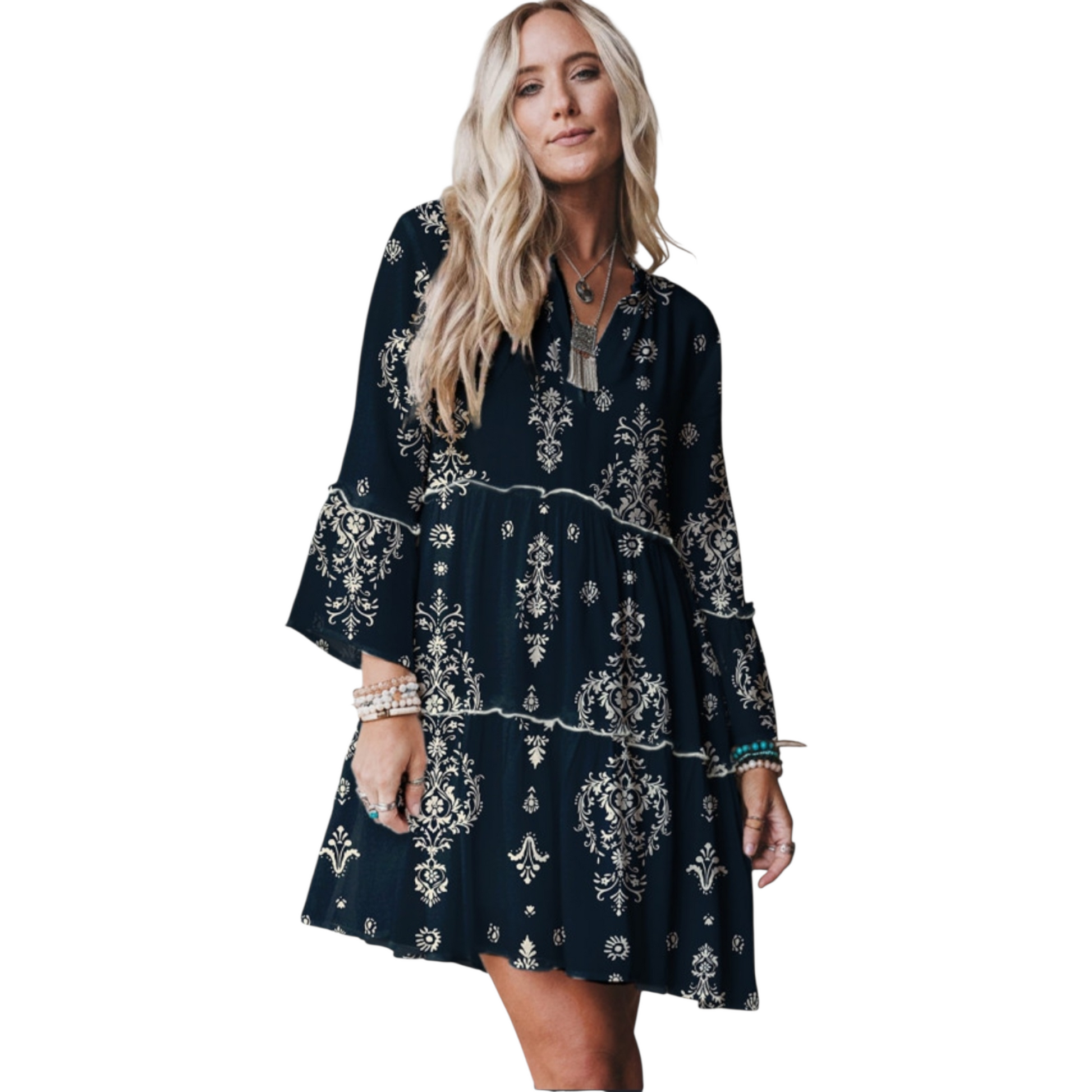 Woman wearing a navy blue dress with white patterns on a white background