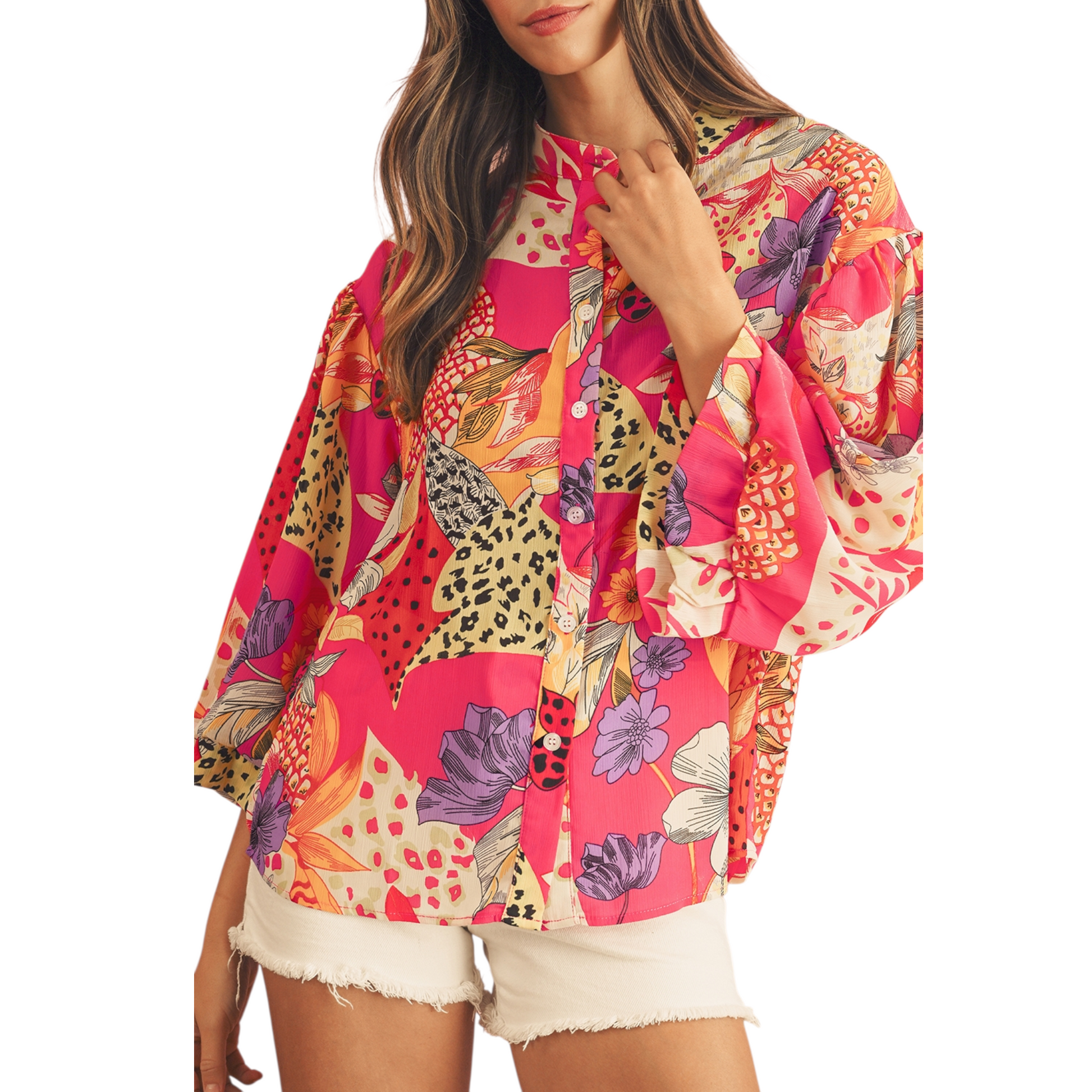 Woman wearing a colorful patterned shirt on a white background