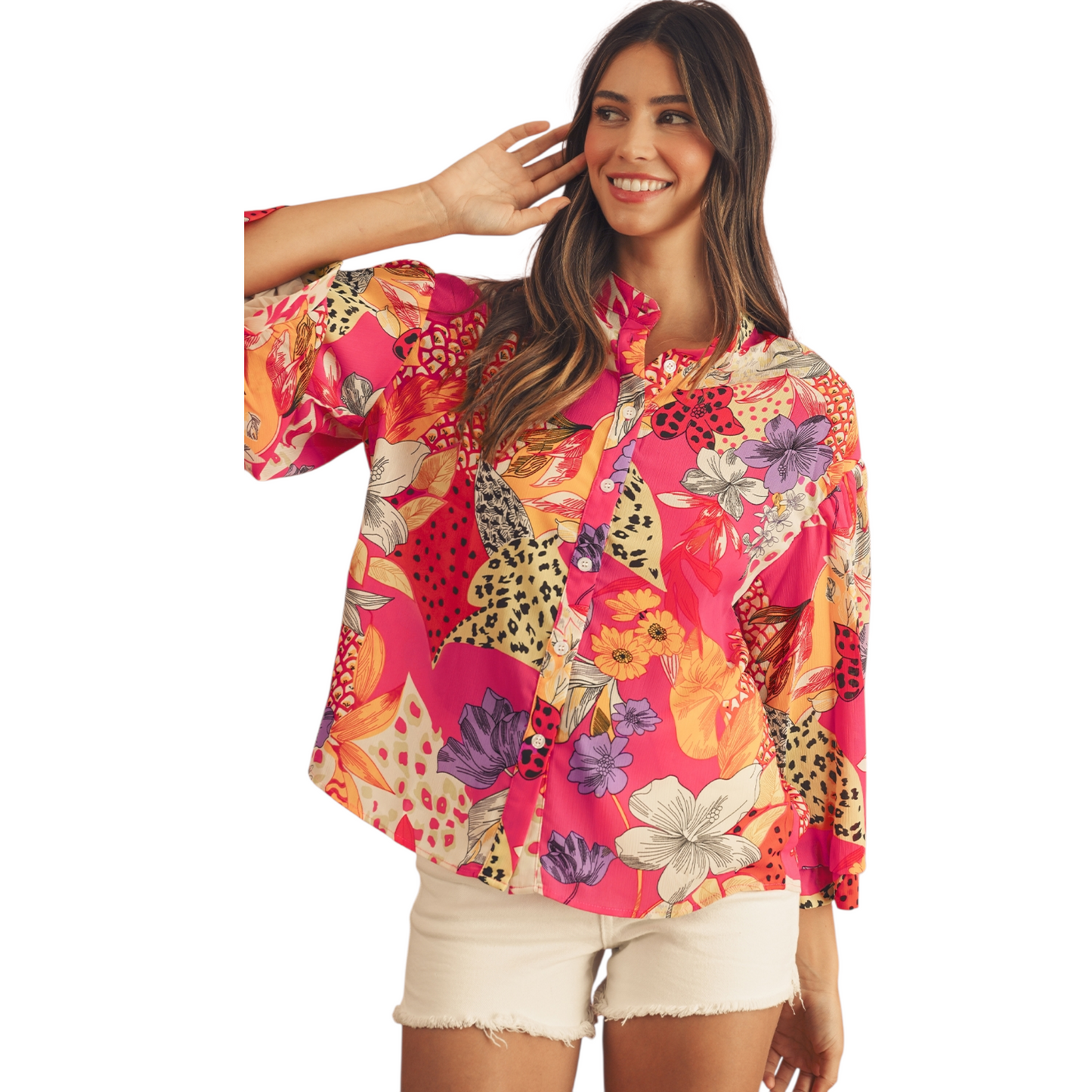 Woman wearing a colorful floral shirt with a white background