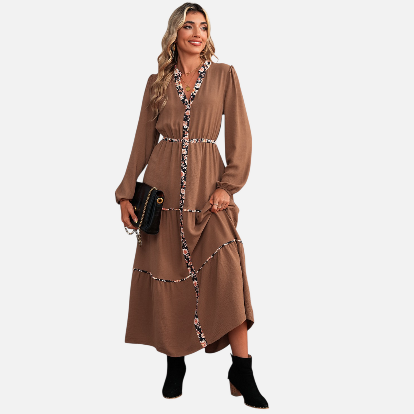 Full-body view of a model in a brown bohemian maxi dress with tiered skirt and floral-accented trim, perfect for elevated daywear.
