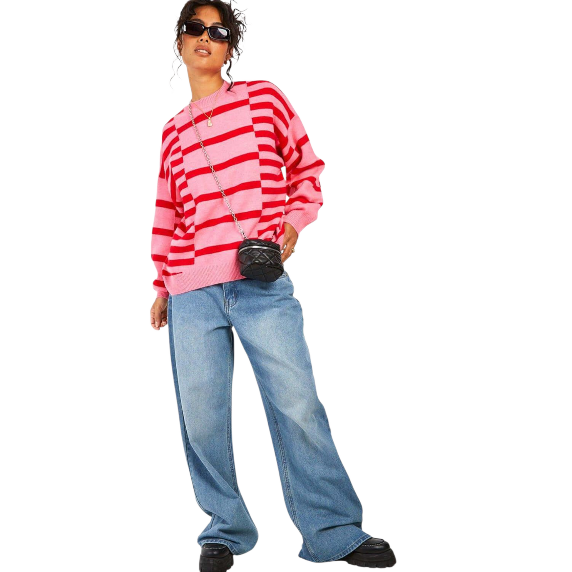 Person wearing a red and pink striped sweater and blue jeans on a white background