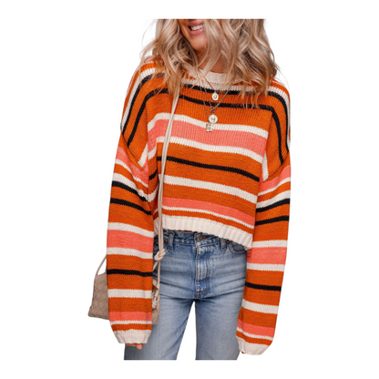 Person wearing a colorful striped sweater with a white background