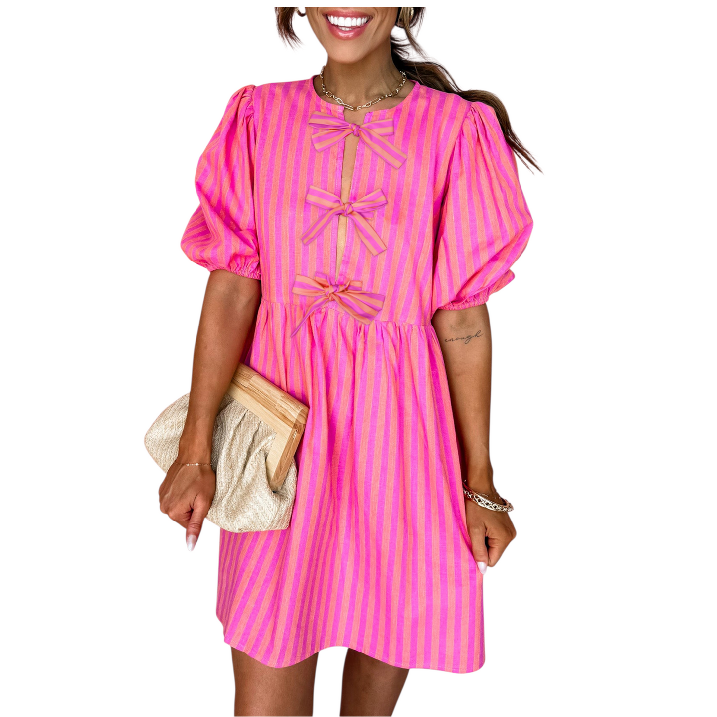 Close-up of a pink and orange striped mini dress featuring three decorative front bows and a round neckline.