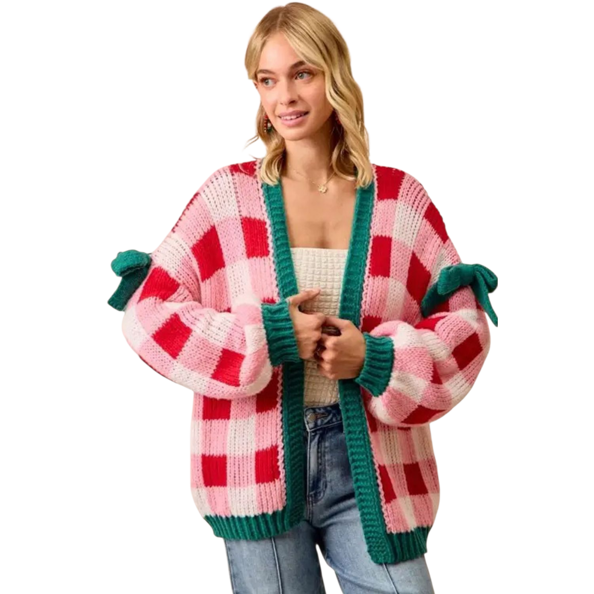 Woman wearing a colorful checkered cardigan with green trim on a white background