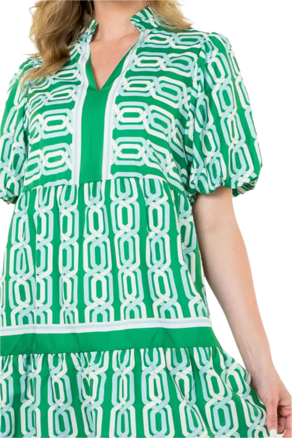 Focus front view of a woman in a bright green tiered mini dress with puff sleeves, perfect for summer events and casual outings.