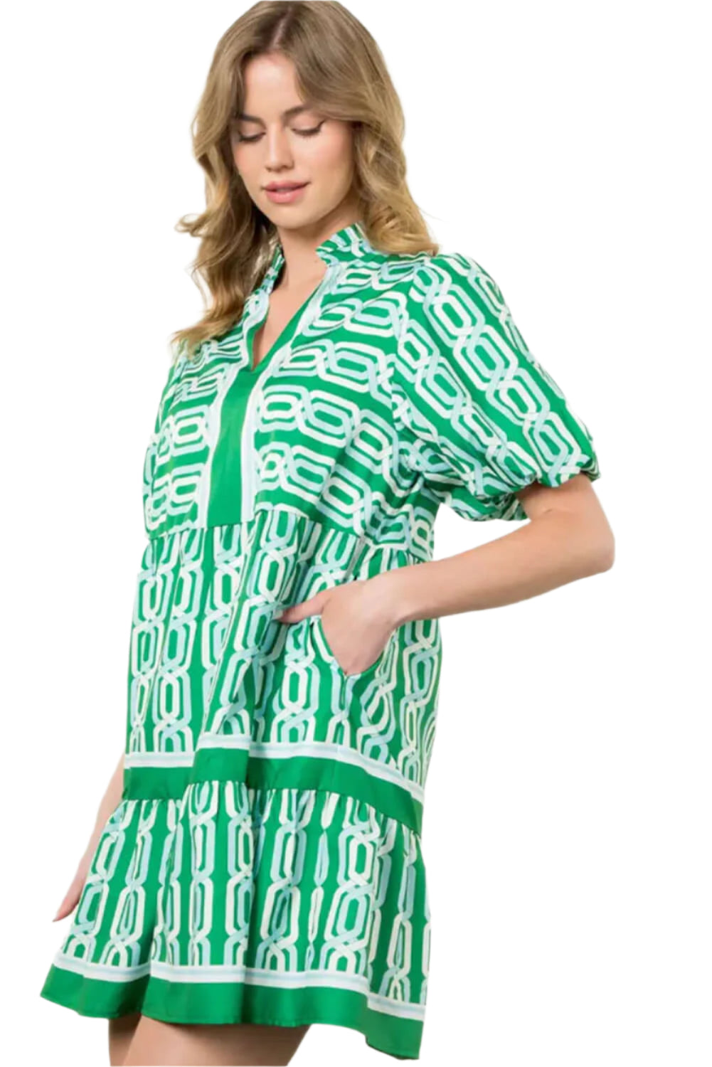 Side view of a woman in a bright green tiered mini dress with puff sleeves, perfect for summer events and casual outings.