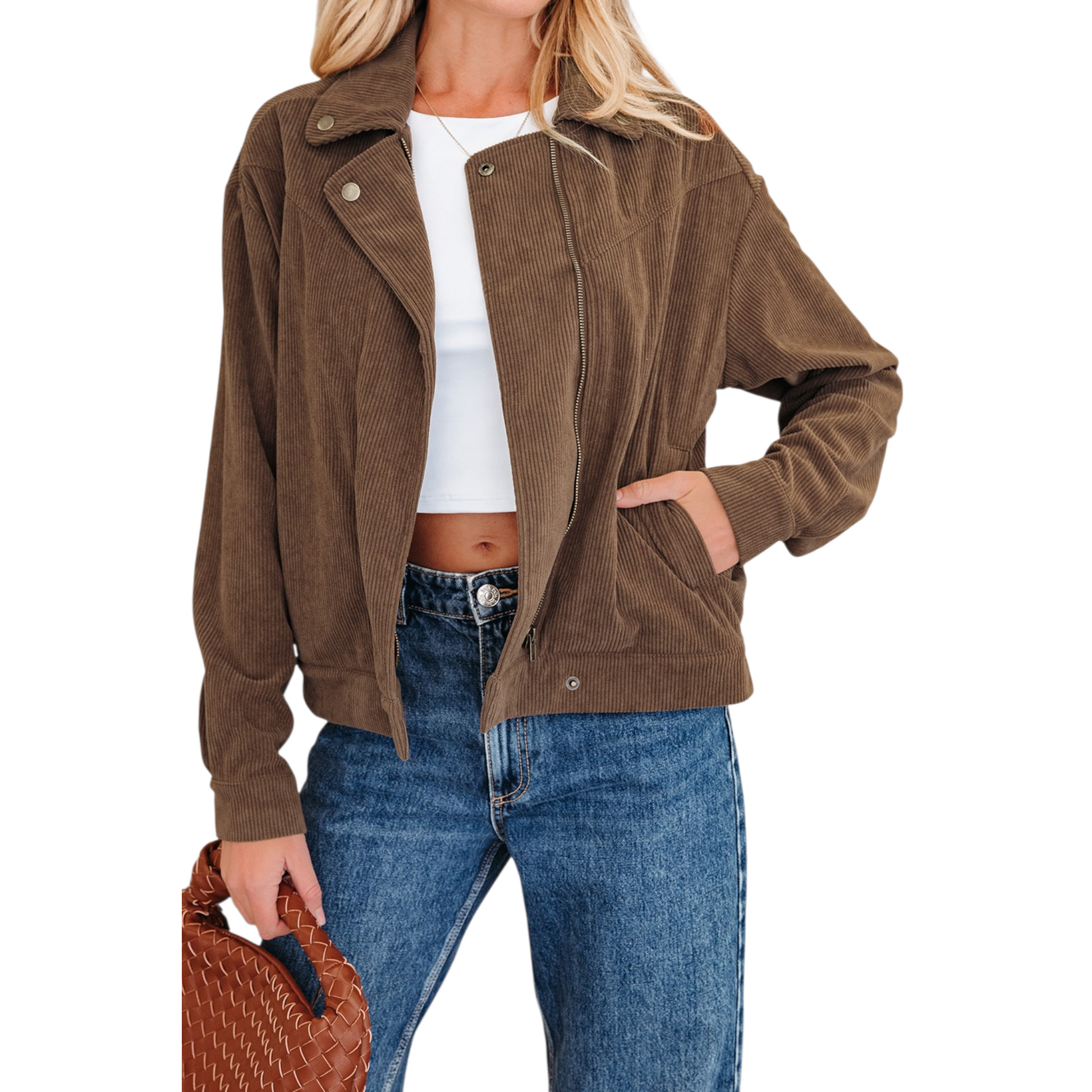 A woman wearing a brown corduroy zip-up jacket over a white crop top and blue jeans, highlighting the gold hardware and functional side pockets.