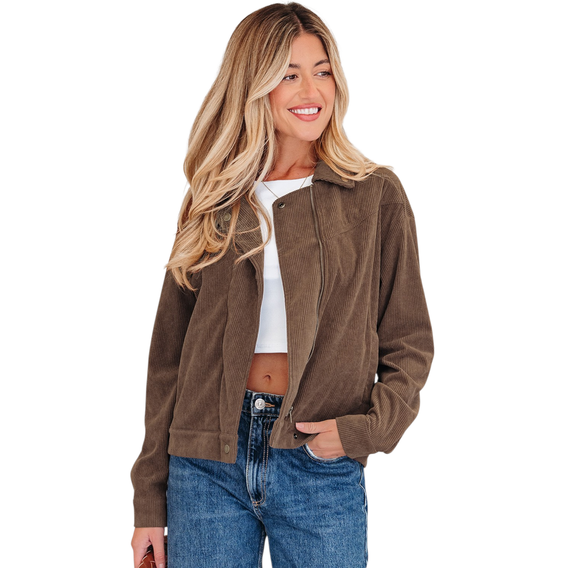 A woman wearing a brown corduroy zip-up jacket over a white crop top and blue jeans, highlighting the gold hardware and functional side pockets.