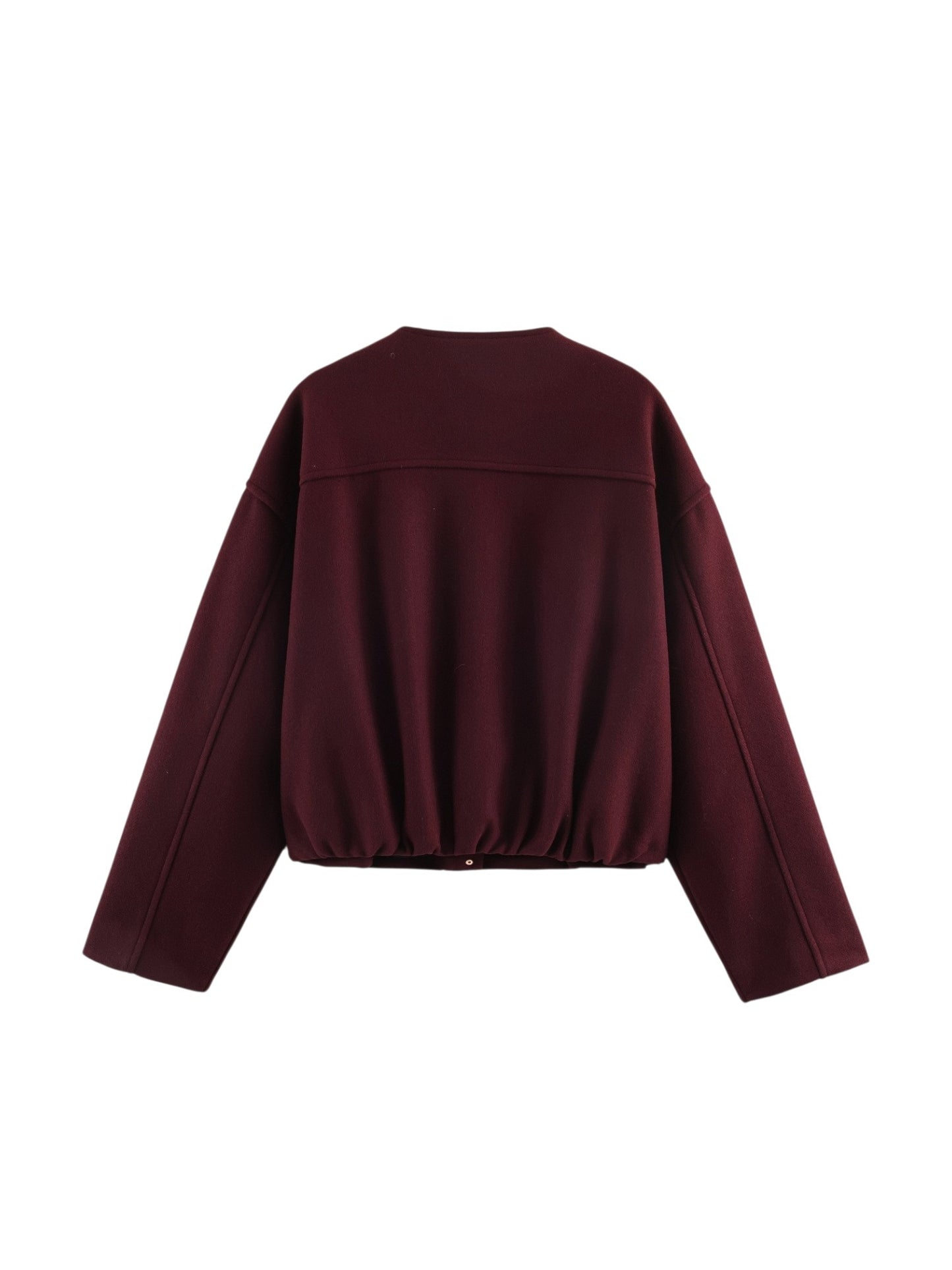 Rear studio flat lay of the burgundy jacket showing the structural drop shoulders and the unique gathered elasticated back hemline.