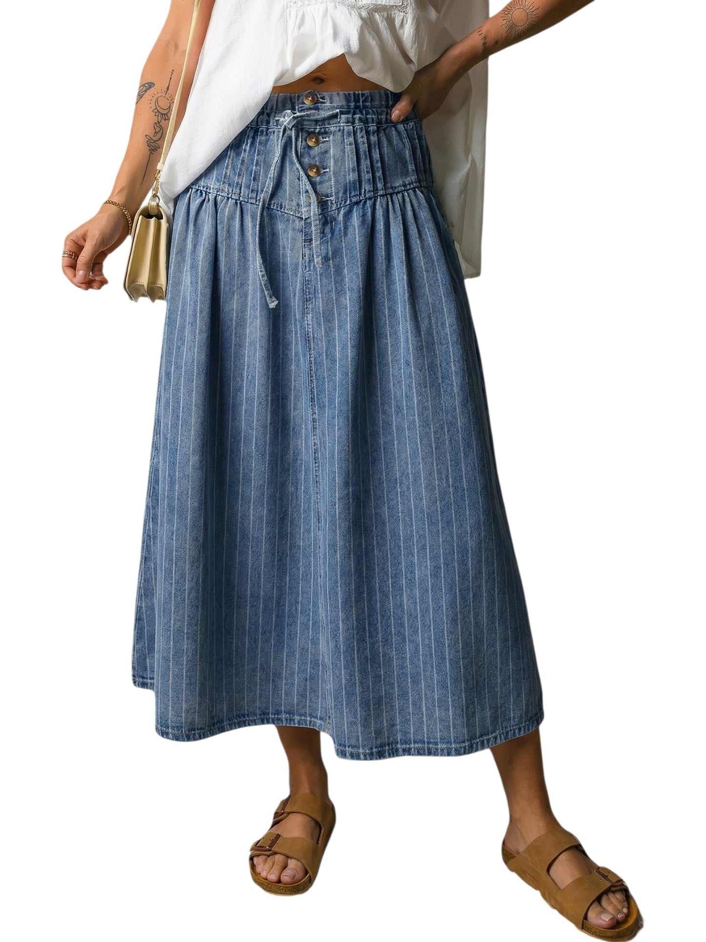 Person wearing a blue denim skirt on a white background