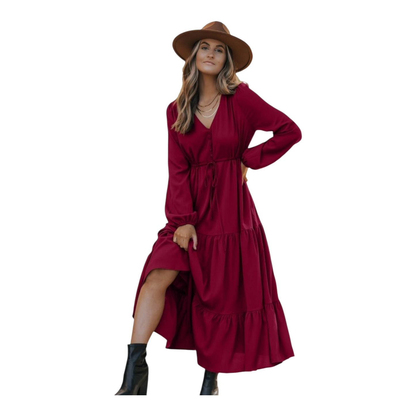 Woman in a burgundy, long-sleeve, tiered maxi dress with a V-neckline and drawstring waist, paired with black ankle boots