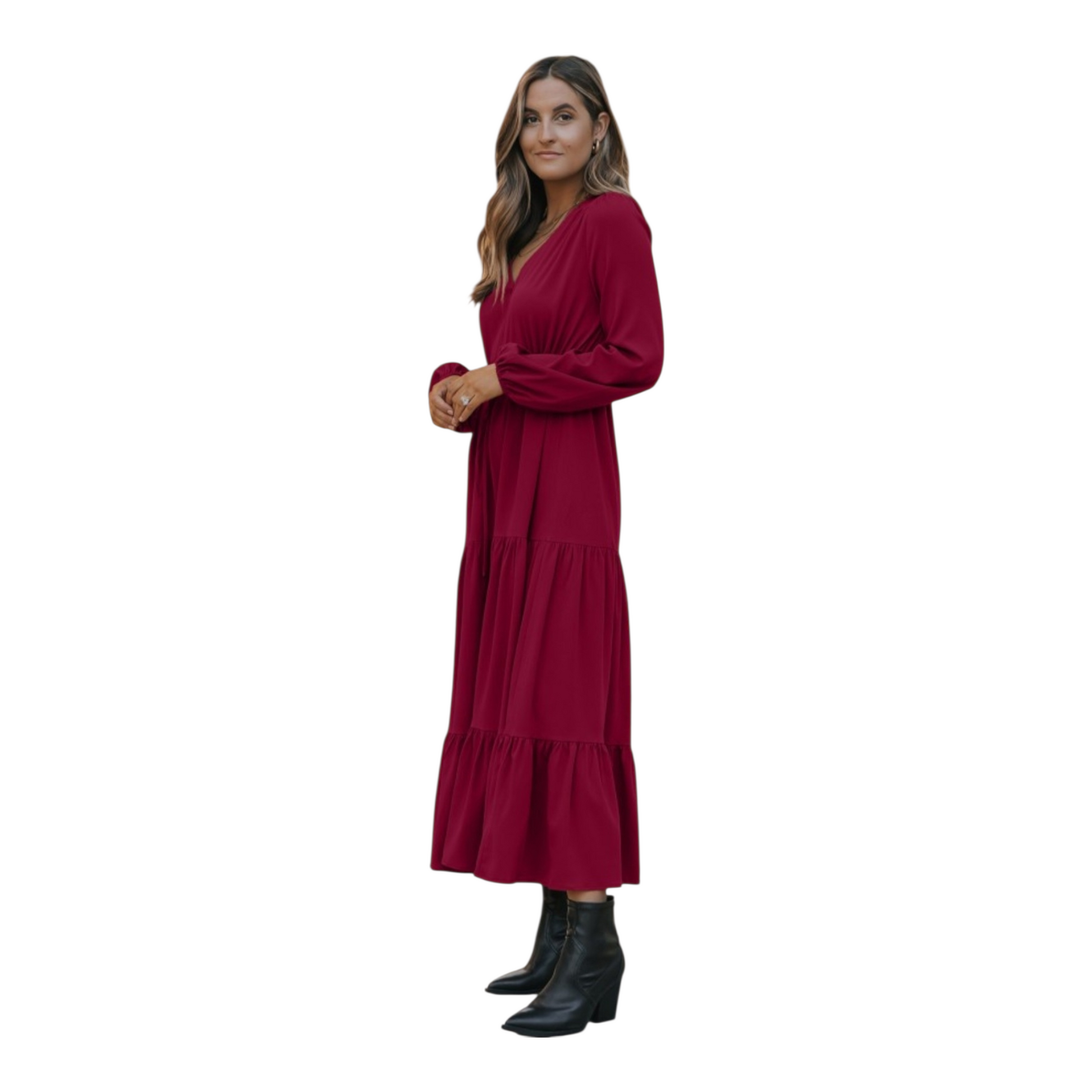 Woman in a burgundy, long-sleeve, tiered maxi dress with a V-neckline and drawstring waist, paired with black ankle boots