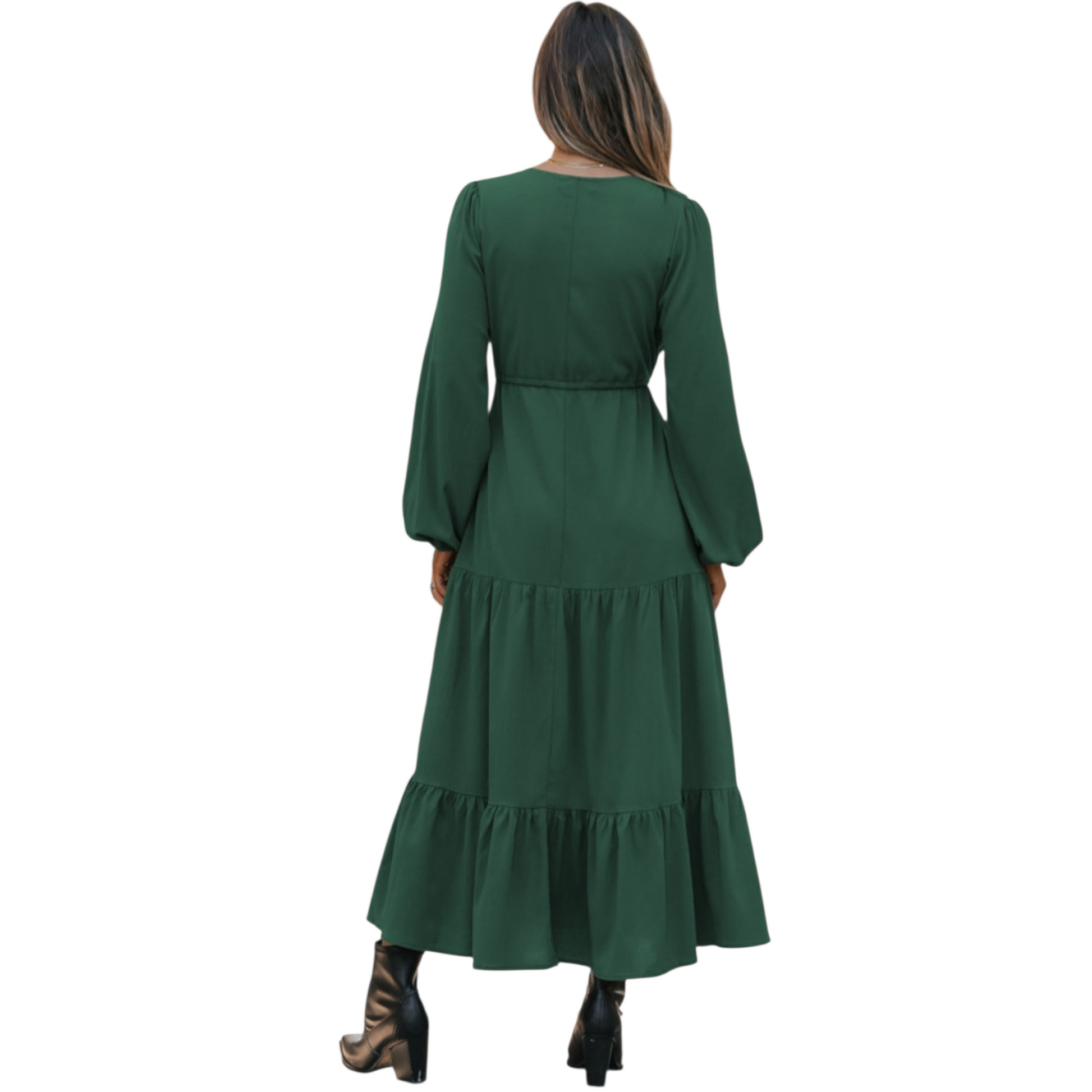Woman in a green, long-sleeve, tiered maxi dress with a V-neckline and drawstring waist, paired with black ankle boots