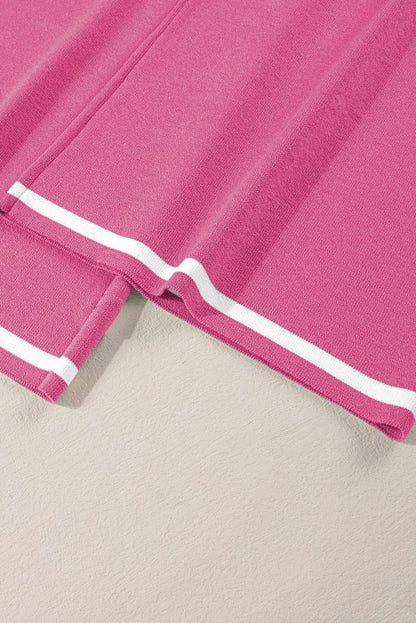 Close-up of a pink fabric with white trim on a beige background