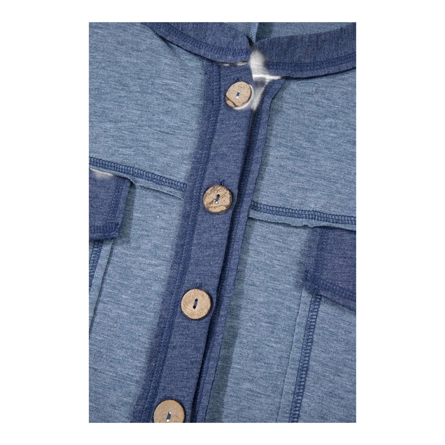 Close-up of a blue garment with wooden buttons