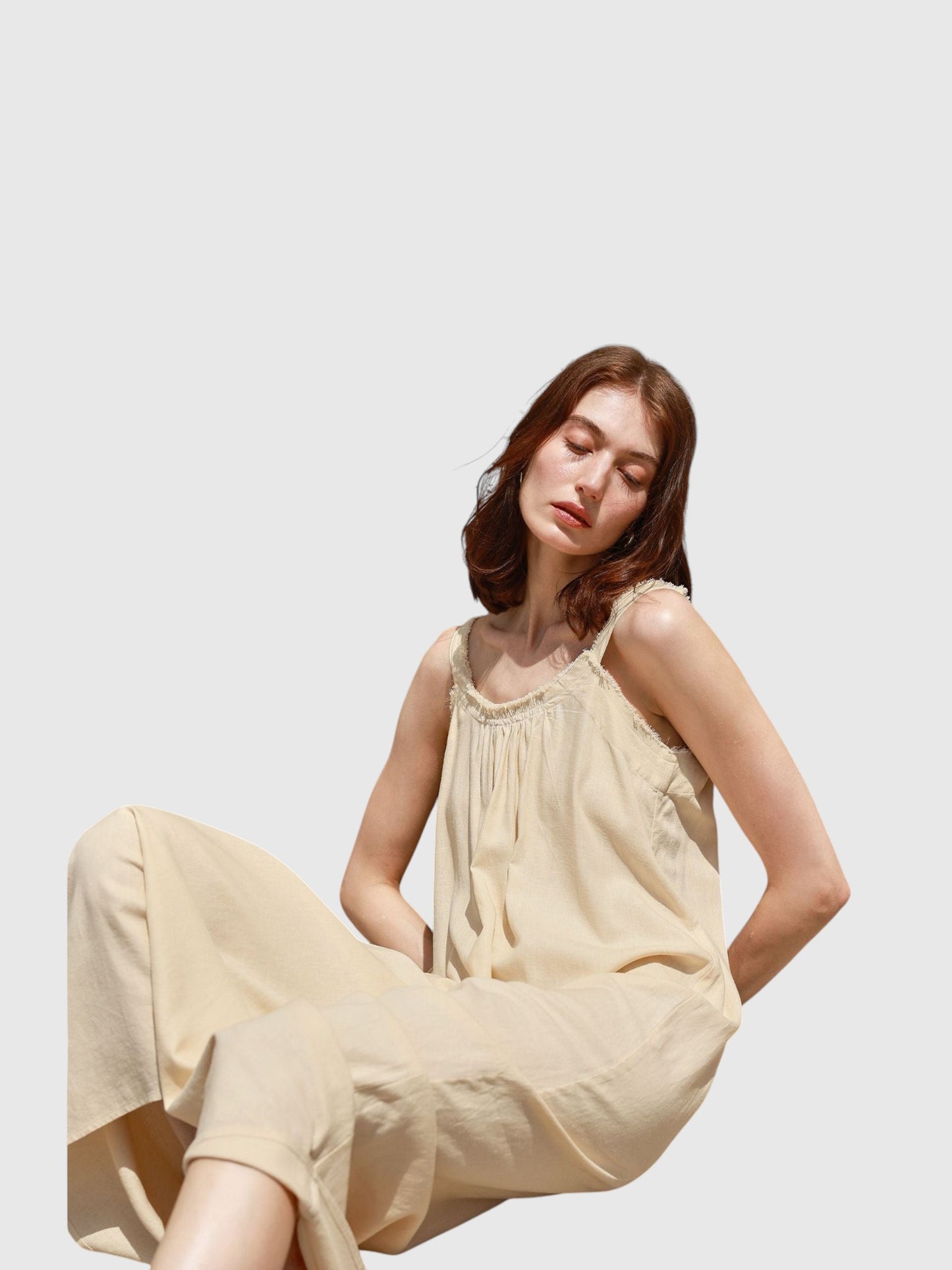 Catherine Martin beige linen and cotton maxi dress with a scoop neckline and frayed raw edge details on a model