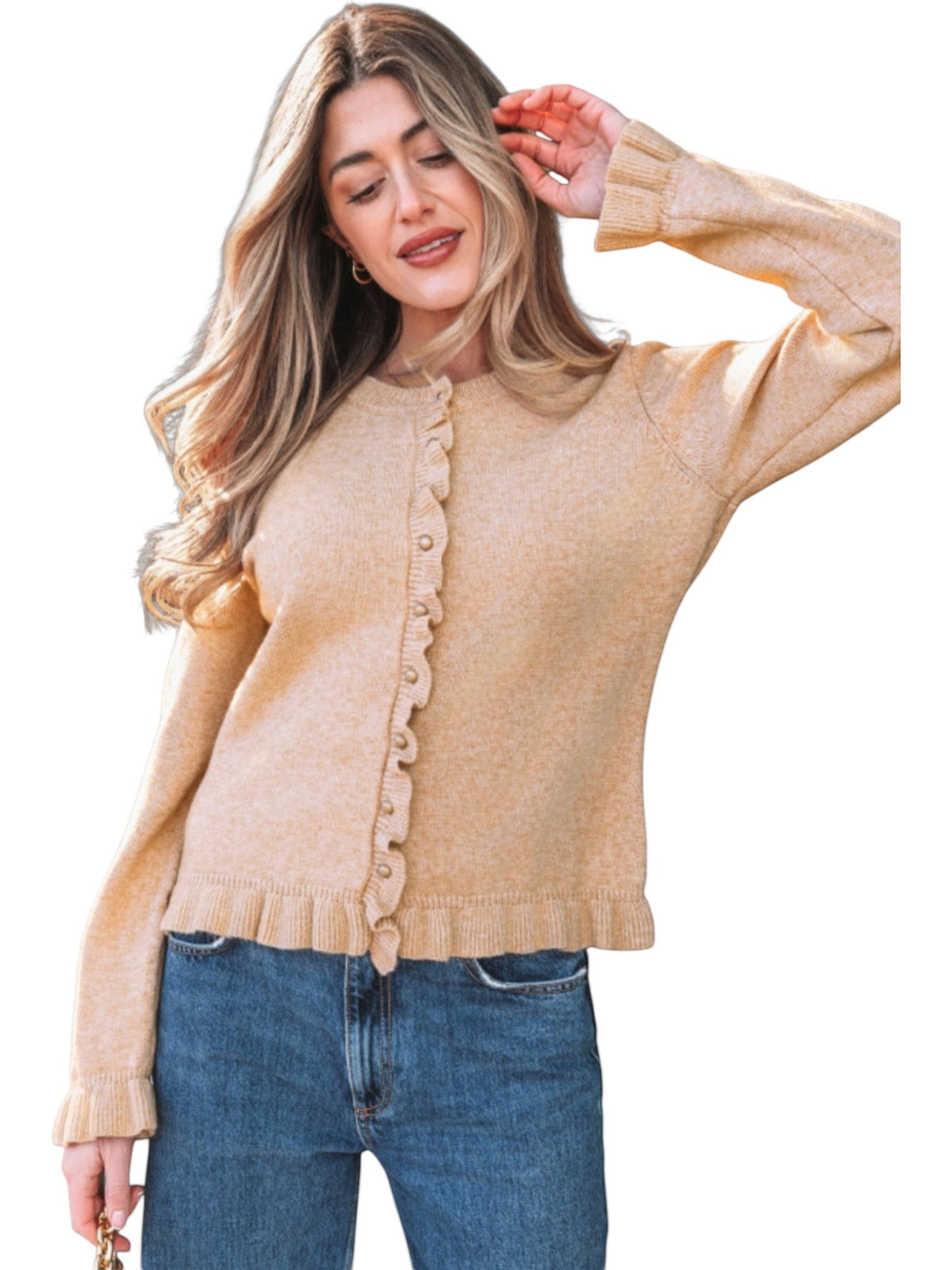 Catherine Martin beige knit cardigan with ruffle trim and gold buttons worn by a woman with long blonde hair