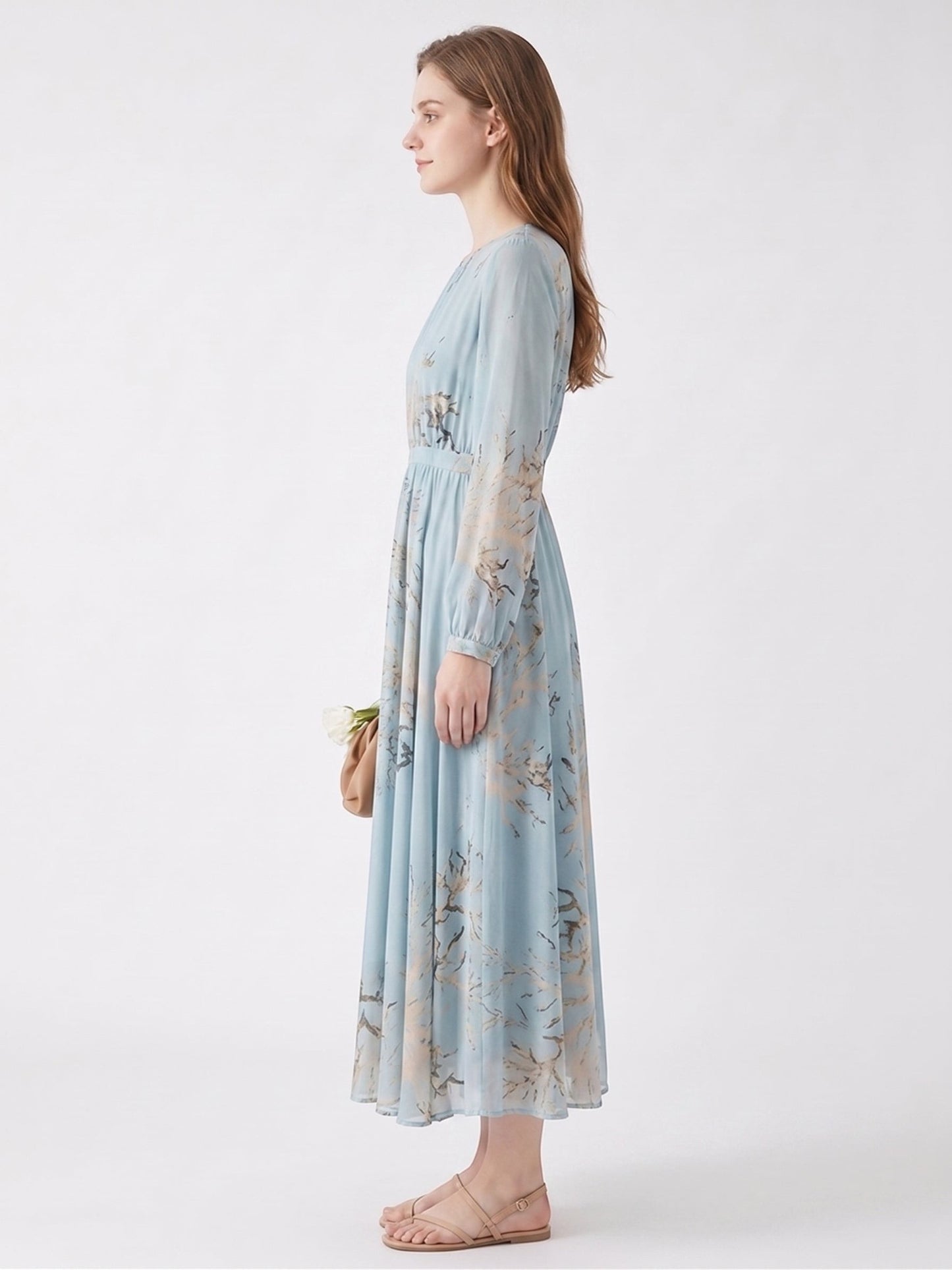 Catherine Martin powder blue mulberry silk midi dress with gold and brown branch print, side view on a model.