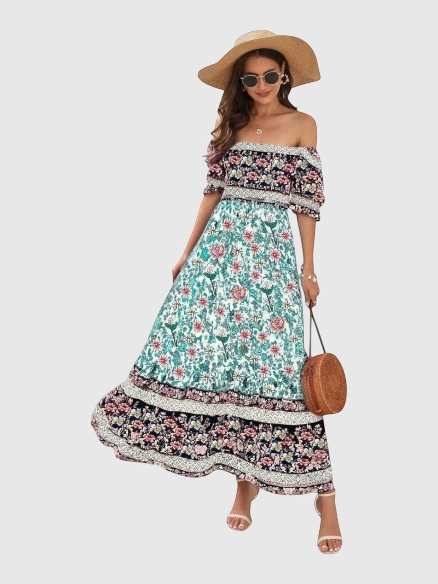 Catherine Martin boho maxi dress in floral rayon with puff sleeves, shirred bodice, and a vibrant border print hem.