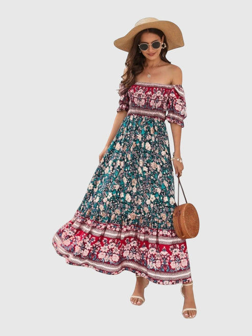 Catherine Martin boho floral maxi dress with puff sleeves, square neckline, and shirred bodice in rayon fabric.