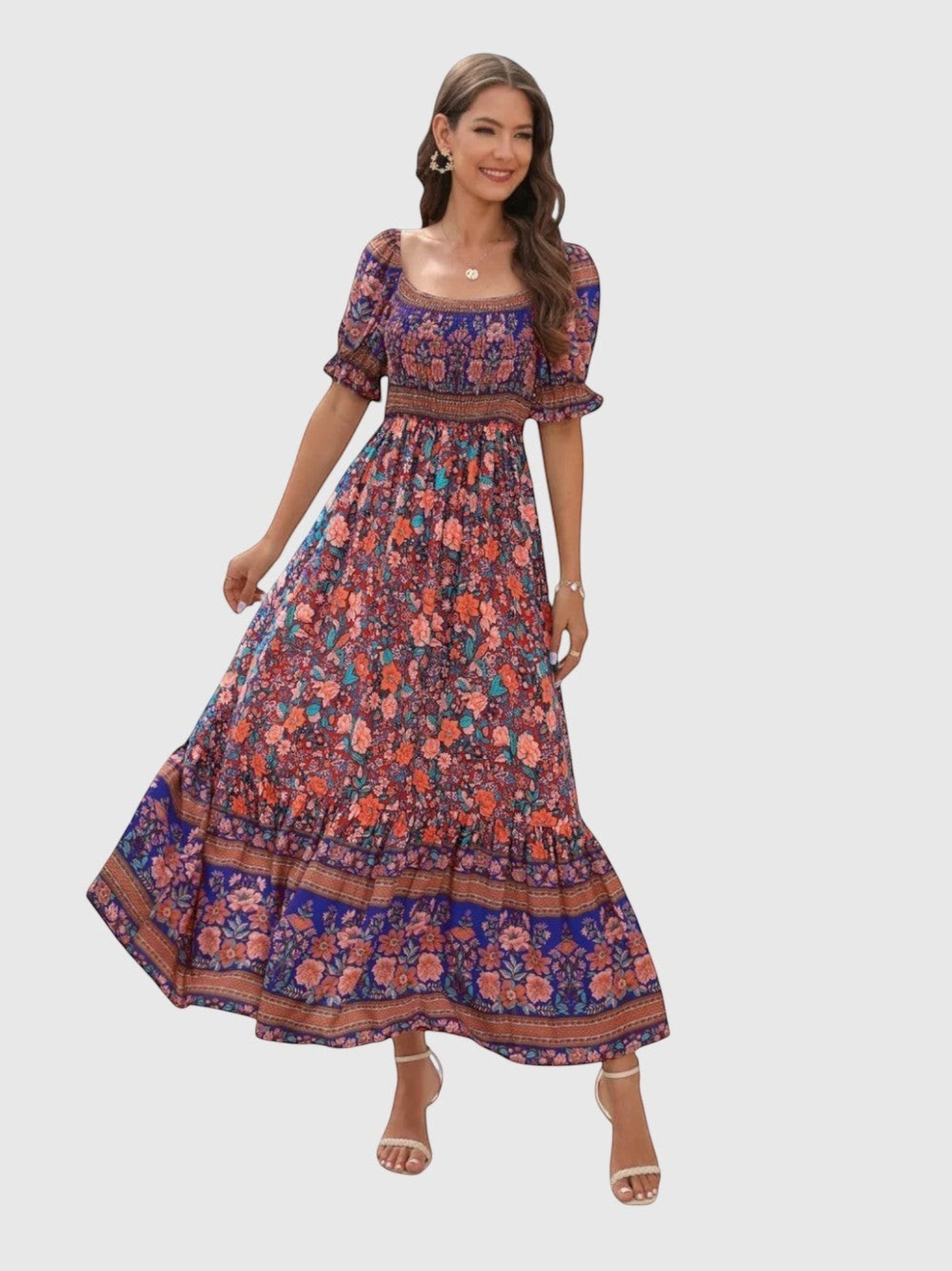 Catherine Martin boho maxi dress in vibrant floral print with square neckline, shirred bodice, and puff sleeves.