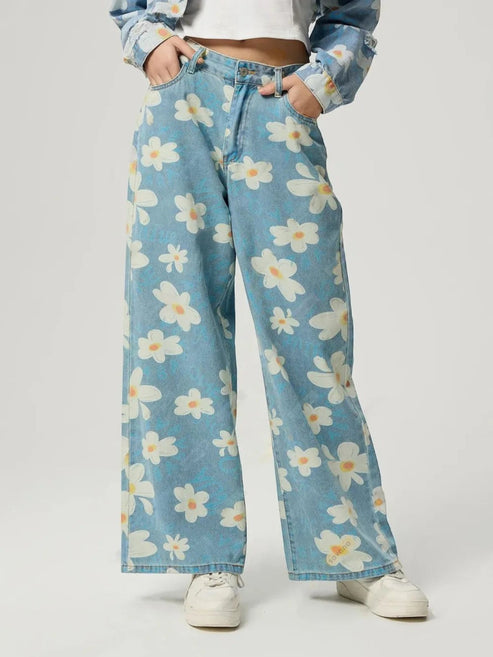Catherine Martin wide-leg denim jeans featuring a playful cream and blue daisy print with a classic five-pocket design.