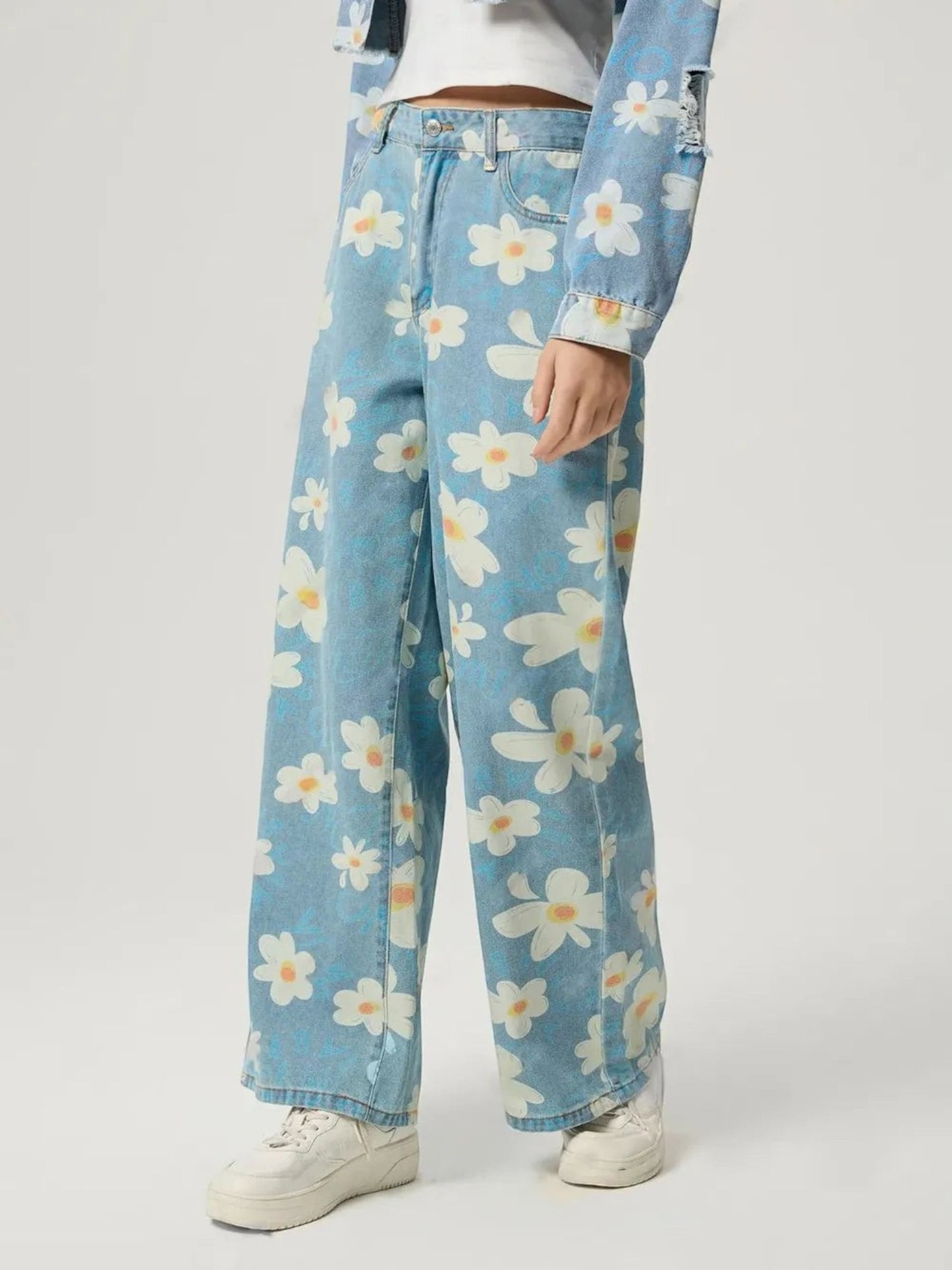Catherine Martin wide-leg denim jeans featuring a playful cream and blue daisy print with a classic five-pocket design.