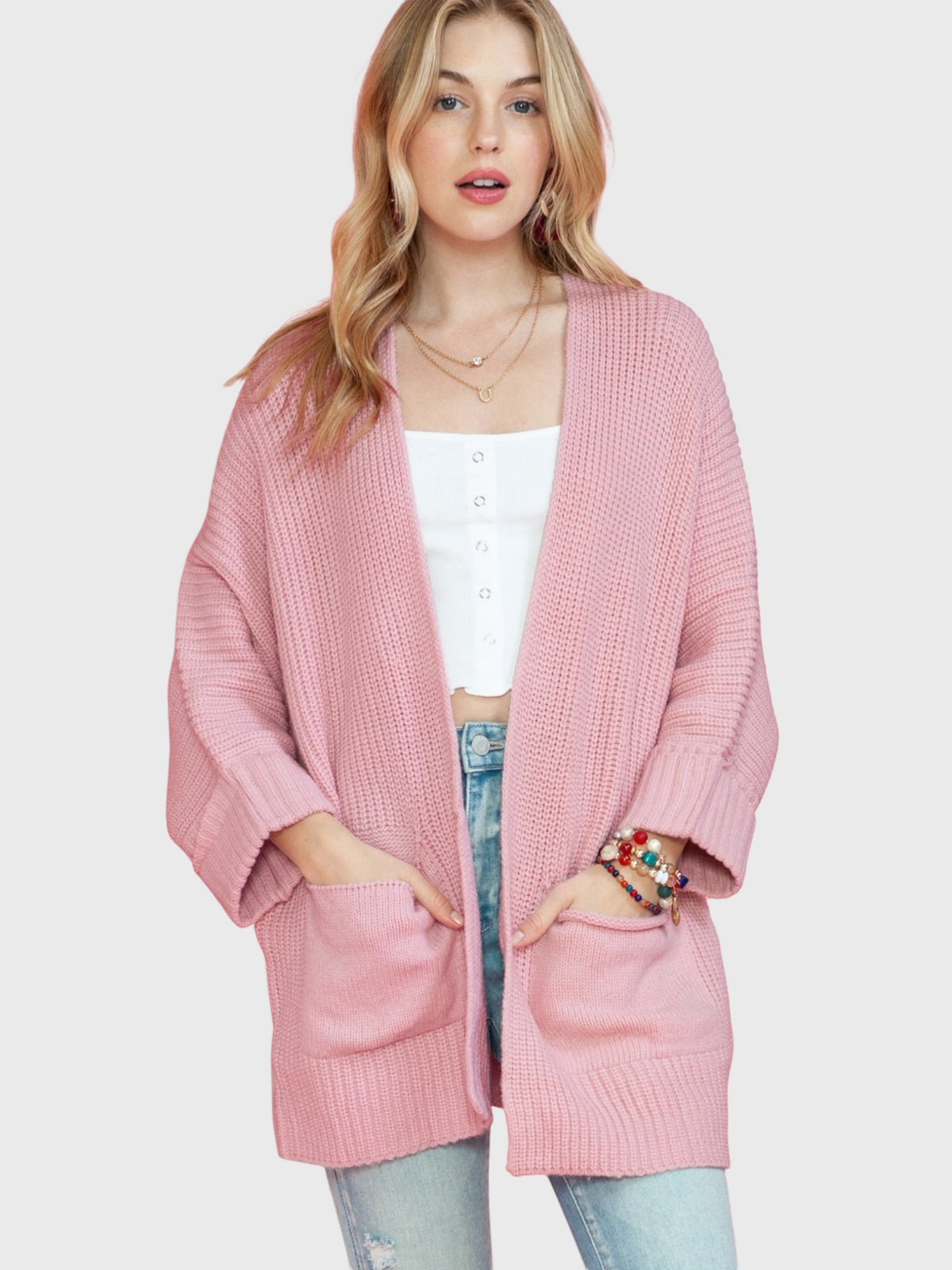 Catherine Martin dusty pink oversized open front knit cardigan with patch pockets and ribbed cuffs on a model