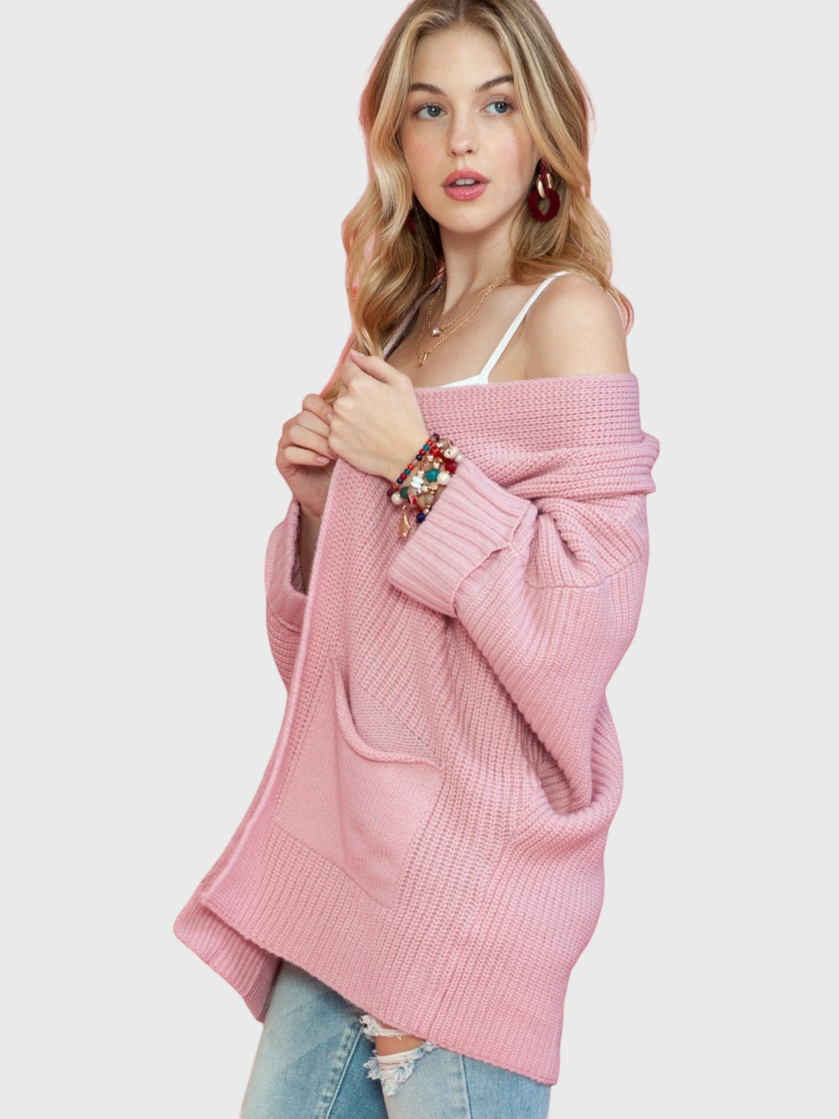 Catherine Martin oversized dusty pink knit cardigan with open front, patch pockets, and ribbed cuffs on a model