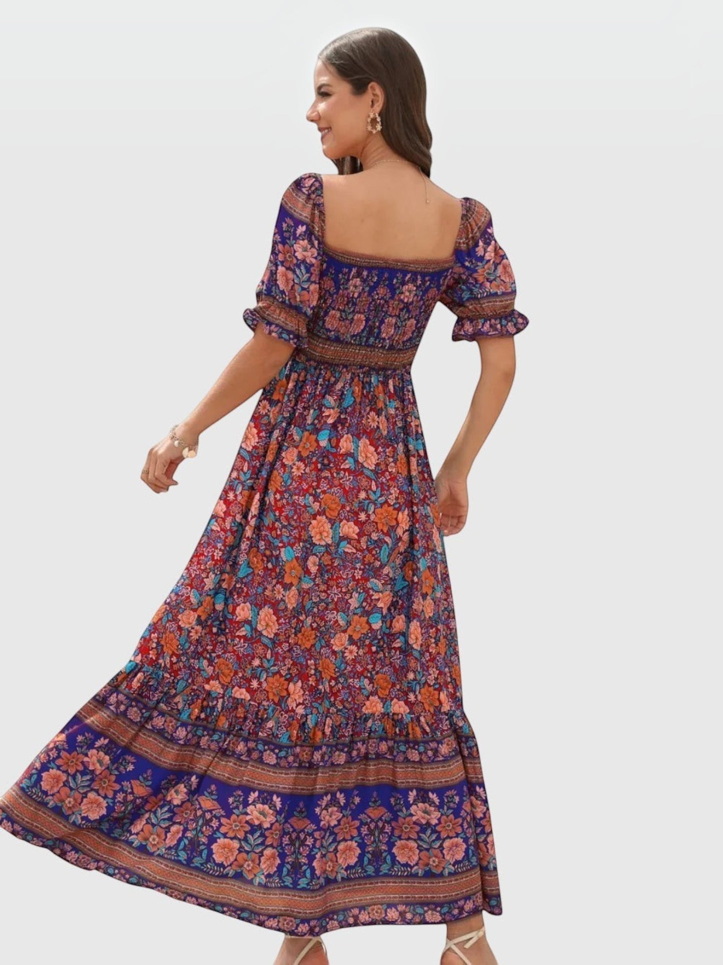 Catherine Martin boho maxi dress in vibrant floral print with puff sleeves, square neckline, and shirred bodice.