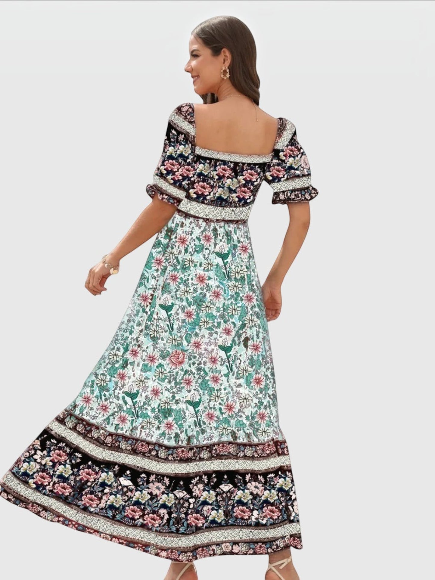 Catherine Martin boho maxi dress featuring a vibrant floral border print, square neckline, and puff sleeves.