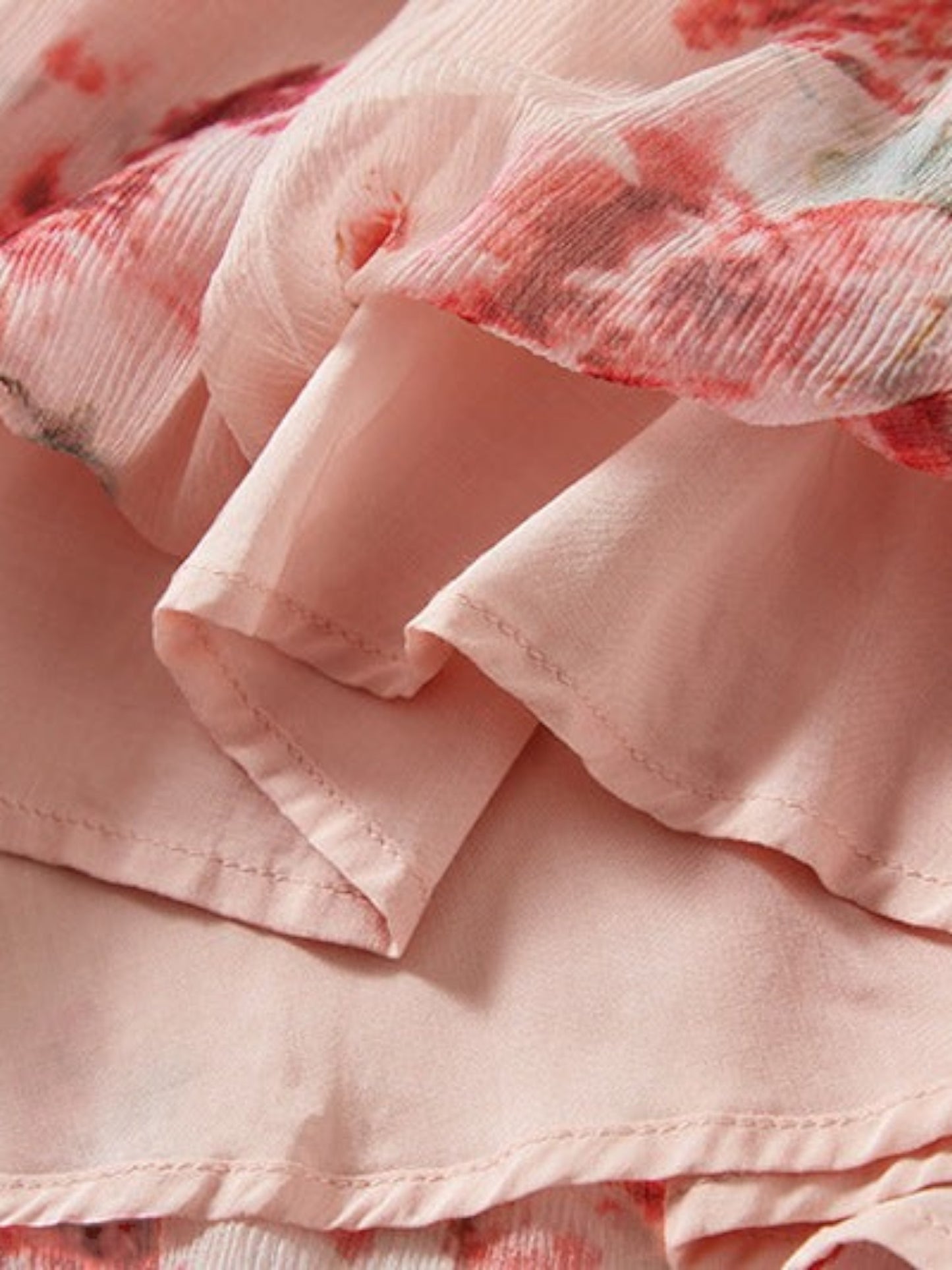 Catherine Martin floral silk dress fabric detail showing layered pink floral print and solid pink lining