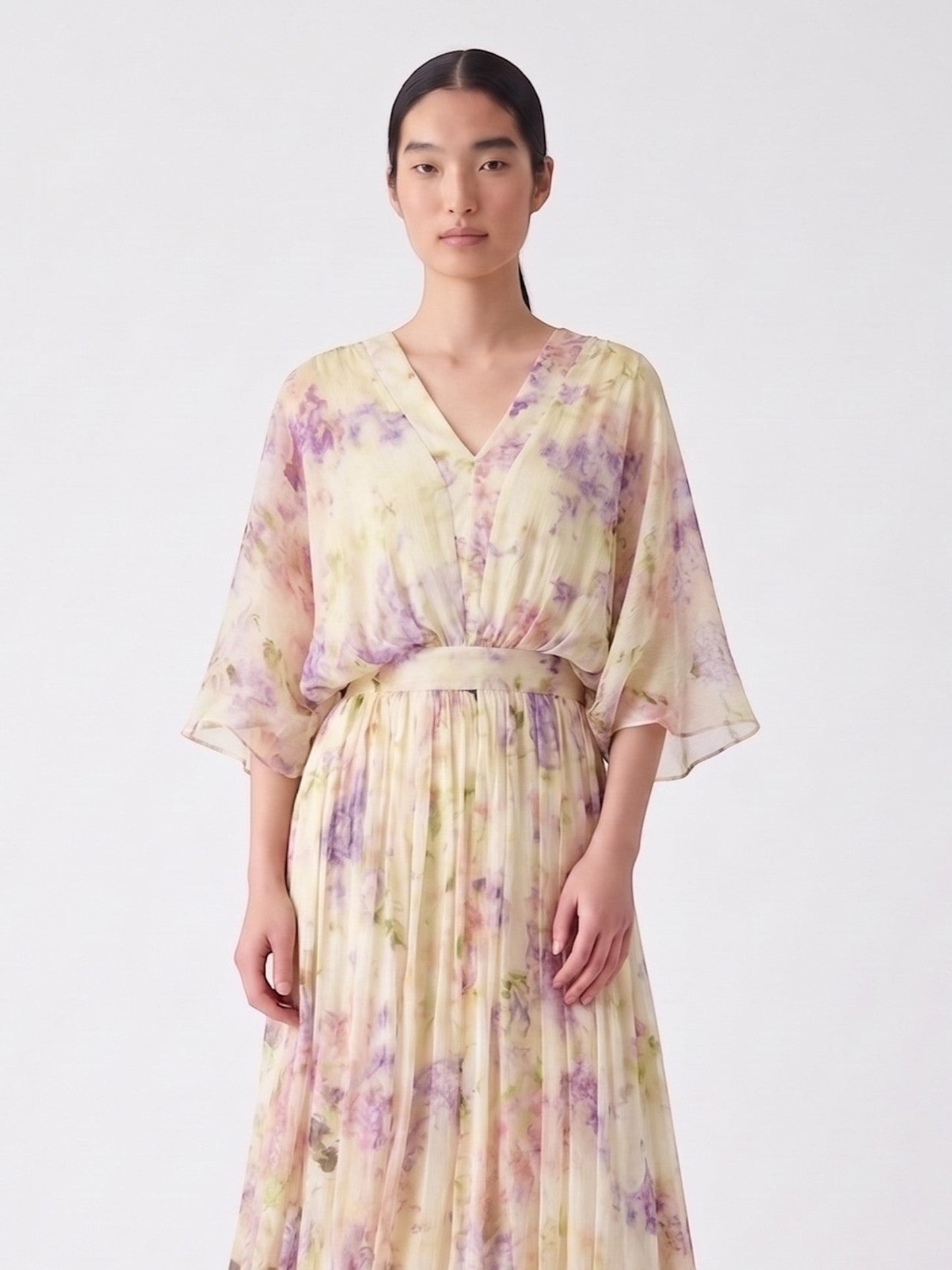 Catherine Martin floral silk midi dress with V-neckline, kimono sleeves, and a pleated skirt in lilac and cream.